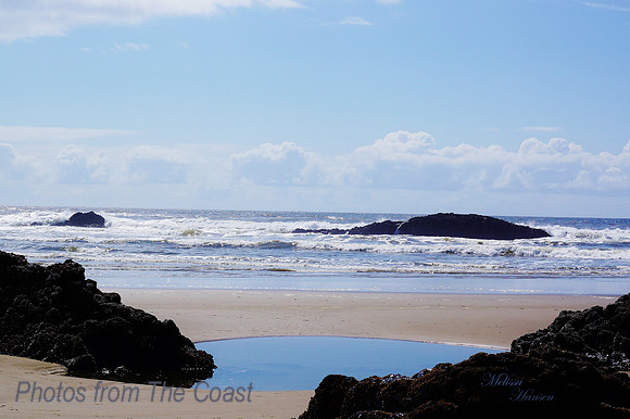 Soft Sand Surrounds Tidepool and Lava Rock