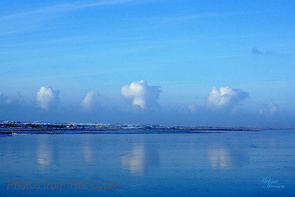 Clouds Reflected on the Beach
