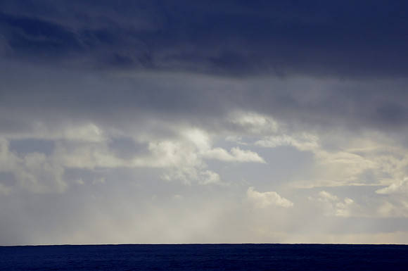 Light Shines Through Wispy Clouds Over Pacific