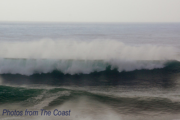 Green wave with huge spray
