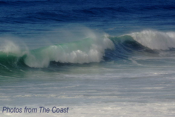 Soft green wave with white spray